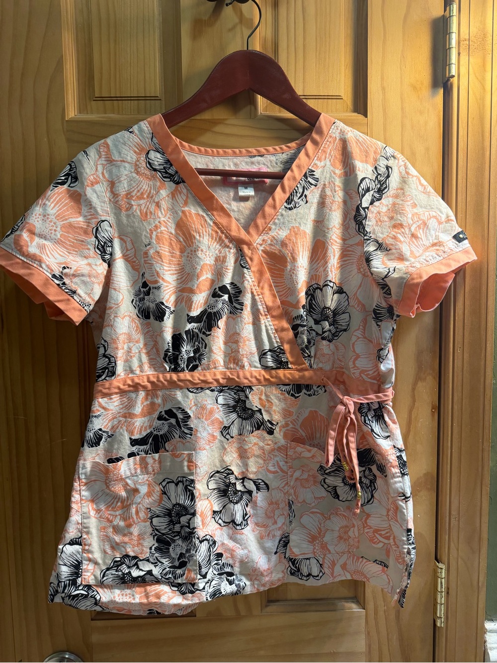 koi Peach and Black Floral Wrap Scrub Top